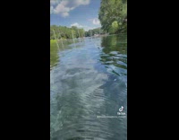 Guy films the deep part of the lake 