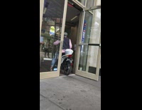 Man drives white moped scooter into bank to use ATM