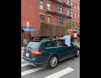 Couch on the car roof at street