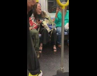 Guy yellow jacket puts iguana on woman on subway scared