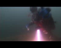 Scuba diver drink Capri Sun juice underwater