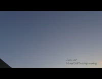 Time lapse white clouds pond drone tractor 