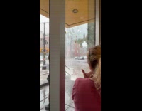 Rapid flood water flows down the street