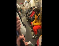 Skilled Man Pole Dances Inside Subway Train