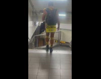 Man walks down the stairs at subway wear caution 