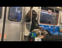 Guy covered in random objects pins subway 