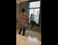 Woman poses by window 