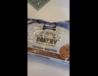 Woman feeds dog cookies from walmart 