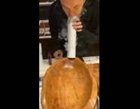 Wooden bowl filled with vape smoke thru tissue tube