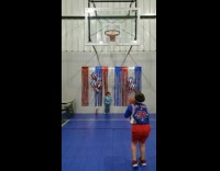 Boy shoots basketball until he makes it in 