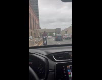 Collab WINY - Man wears sweatshirt rides bicycle on highway