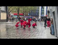 Group women red clothes dance wet street part 2