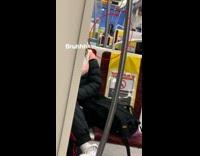 man in the back of the bus smokes