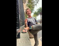 Middle aged man checks the time from his ankle 