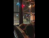 Woman wear motorcycle helmet at bowling alley