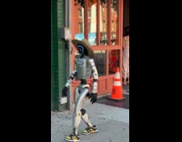 Rizzbot walking on sidewalk with security chaperone pt. 1 