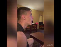 Guy stares with open mouth at TV then realizes he is being recorded
