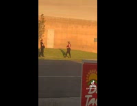 Collab IITW - Woman in red top black leggings tiktok dance near the drive thru