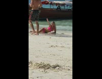 Woman pink bikini laying on sand pictures