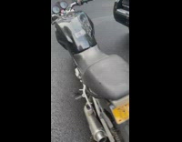 Motorcycle stand sink into the new pavement