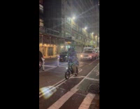 Random person wears Christmas tree rides bike