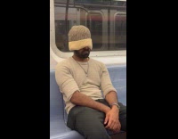 Collab Subway Creatures - Man sleep in train beanie hat cover eyes