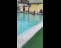 Woman in bikini lie down on the poolside