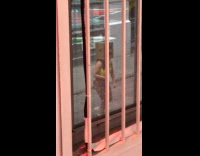 Woman robot head mask dance on street