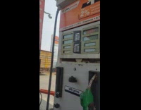 Car owner sweeps up clean the gasoline nozzle