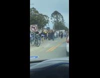Peaceful protest people march chant by car 
