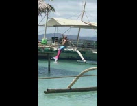 man in mermaid tail on rope
