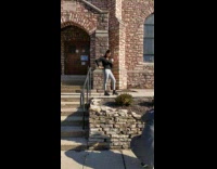 Woman grey leggings hold white coffee cup