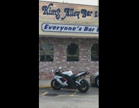 Woman red shirt aerobic dance Kims alley bar