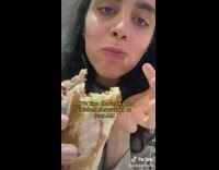 Girl eating chicken shawarma