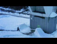 Guy rides green snowboard jumps hits wall