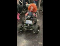 Toy chucky doll holds knife car subway 