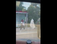 Girl white blanket ghost costume sunglasses street