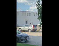 Man black tank top wall hole photo shoot