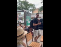 Couple on motorized handicap shopping cart 