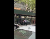 Guy wearing helmet runs while friend in wetsuit watch