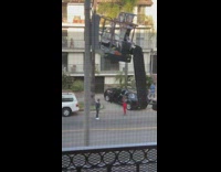 Guy grey shirt stand street car lift