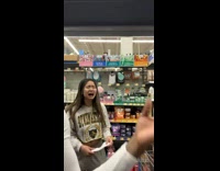 Group of friends in aisle of store cring filter laughing