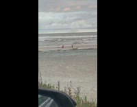 Two girls empty beach sand car mirror 