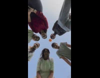 Group of friends play camera game where ball eliminates friends