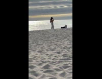 Woman bikini top poses for beach photo Part 1