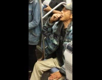 Man eats packet of sugar on the subway