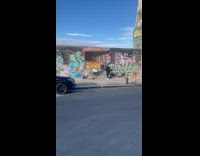 Men filming music video on sidewalk part 1