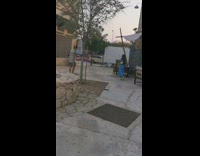 Woman in Blue Dress Jumps and Spins for Photo