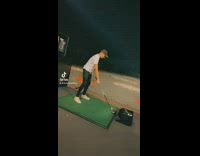 Guy swings golf club with one arm 