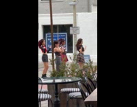 Four women group dance video on street